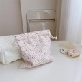 Detail of floral drawstring cotton pouch showing soft pink patterns and texture - Pink Marble Pattern