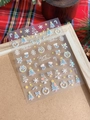 Detailed Christmas nail stickers with snowflake and tree patterns on festive plaid background - YT4199 Holographic Laser Embossed