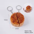 Realistic PVC mooncake keychain set with traditional character relief and metal ring - Pair of Egg Yolk & Red Bean Mooncakes (2 Halves) - With Keychain