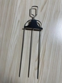 Close-up of stainless steel three-prong barbecue fork with metal handle on wood background - Three-Prong Fork