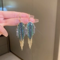 Macro detail of long tassel earrings with sparkling blue and green rhinestones - 14# Gold Blue Green Rhinestone Thin Tassel Style
