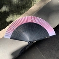 Pink and black gradient folding fan with floral patterns and black decorative silk tassel - Hollow Fireworks Pink Blue
