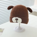 Détail du bonnet d'hiver en tricot pour bébé avec oreilles de chiot en laine marron - 6 mois - 2 ans / café
