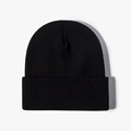 Classic black knitted beanie with cuffed design for winter warmth and outdoor style - Black
