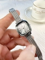 Close-up of a silver square face watch for women with metal mesh band and Naidu logo - Silver White Dial