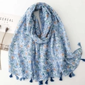 Blue floral cotton linen scarf with small fringe tassels on a minimalist white surface - Blue Floral Pattern (SL2501-012)
