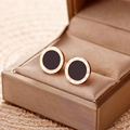 Minimalist rose gold and black Roman numeral stud earrings on a champagne satin box - Roman Studs / Rose Gold