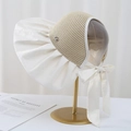 Detail of a wide brim sun hat with beige woven top and elegant white fabric waves - M (56-58cm) / Off White