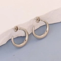 Polished silver irregular geometric C-shaped stainless steel earrings on a textured stone surface - Silver Style K7-18