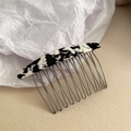 Detail of tortoise shell acetate hair comb with ten durable metal teeth for styling - 10-Teeth Hair Comb / Black and White Marble