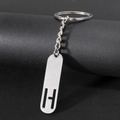 Sleek silver metal keychain featuring a modern hollow letter H pendant on black stand - Letter H