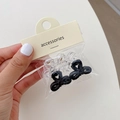 Mini acetate bow hair claws in black and clear colors on retail card packaging - Bow Clear Black (Set of 4)