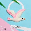 Detailed view of bird-shaped resin accessory with 2.2g weight and 2.3x3.4cm dimensions - Pink Seagull Flying Right