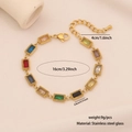 Macro detail of gold stainless steel bracelet with square colored glass stone inlays - Rectangular Style