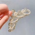 Detail of golden peacock hair claw clip with sparkling rhinestones and white pearls - Peacock Rhinestone Pearl Claw Clip