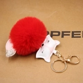 Detail of red plush fox keychain with leather fox head and gold lobster clasp charm - Red