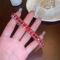Elegant silver-toned bracelet featuring triple-row square ruby red cubic zirconia stones - Three-row Red Diamond Bracelet (GA1284)