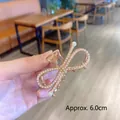 6cm champagne gold metal hair claw clip with white pearls in elegant crossed design - Bow Pearl
