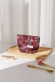 Close-up of pink rose floral makeup bag with gold zipper and branded woven label - Small (17x14cm) / Rose Red