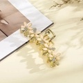 Elegant gold hair clip featuring five pink floral motifs with sparkling rhinestone centers - Flesh Pink Rhinestone