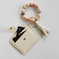 Detail of beige silicone beaded keychain bracelet with PU card wallet and tassel charm - Beige Woven Card Holder with Beige Pink Leopard Silicone Beads