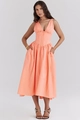 Detailed view of the coral orange V-neck maxi dress with cinched waist and pleated skirt - Orange