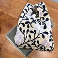 Knitted tote bag featuring cream base with navy leaves and lavender floral patterns - Purple Flower