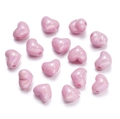 Macro shot of 15 pink heart-shaped DIY beads with a pearlescent finish for jewelry making - 13X15mm / Pink