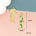 Detailed macro view of white rose enamel pendants with gold back and 31x15mm measurements - Carnation