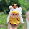 Labubu doll wearing yellow jacket and white duck plush hat with a small brown bear - Kapibala Duck Set / First And Second Generation Keychains Are Compatible With La Cloth Dolls. Dolls Not Included.