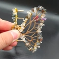 Detail of handmade butterfly hair claw with natural amethyst and colorful crystal gravel - Black Rutilated Quartz Gold Butterfly