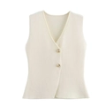 Detail of cream knit vest featuring a V-neckline and elegant gold button accents - White
