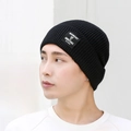 Black ribbed knit beanie with letter patch for men and women in winter fashion style - Black