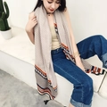 Beige plaid scarf with geometric patterns and tassels, displayed by a model on stairs - Khaki Patchwork Geometric Style (37131)