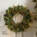 50cm Christmas PE wreath with natural pinecones and warm LED lights on a white wall - PE Wreath-50cm With Lights (USB Powered)