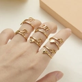 Minimalist gold adjustable letter and heart ring set for women on model's hand - Letter M / Gold