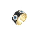 Detail of adjustable gold ring with black enamel and blue evil eye patterns - Adjustable Open / Black