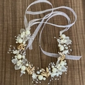 Handmade bridal headband with golden leaves, pearls, and white ribbon on wooden surface - With Ribbon / Gold