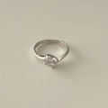 Adjustable silver ring with sparkling round cut cubic zirconia on a beige background - Single Round Clear Stone Simple Style (MY38797)