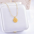 Golden bead chain necklace featuring an octagonal coin pendant with female portrait relief - Girl Portrait Relief