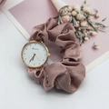 Close-up of pink satin ribbon watch strap with silver metallic dots and rose gold case - Lotus Pink