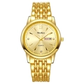 Macro view of gold quartz watch dial with date display and sparkling crystal markers - Gold