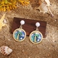 Tropical style gold earrings with pearl studs and enamel palm tree charms on sand - Tropical Palm Tree Pearl Dangle
