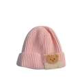 Pink knitted winter hat for babies featuring a cute brown bear plush embroidery - LUCK Bear Pink