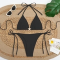 Black two-piece bikini with gold starfish charm and side-tie high-cut bottoms - Black