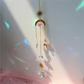 Bohemian gold sun moon star suncatcher with hanging crystal prisms on a light background - US 10