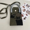 Detail of green knitted crossbody bag featuring black cat designs and pearl accents - Green Three Cats