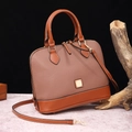 Detail of lychee pattern PU leather handbag with gold hardware on a wooden stand - Elephant Gray