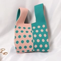 Knitted tote bag with vibrant pink and green contrast polka dot patterns and dual handles - Two-tone Polka Dot Pink And Green