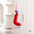 Ciondolo calza di Natale in peluche rosso con pompon viola e bianchi per decorazione - Calzini / viola-rosso